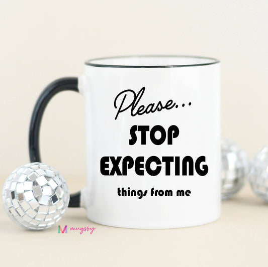 Please Stop Expecting Things Funny Coffee Mug: Black Rim/Handle / 11oz